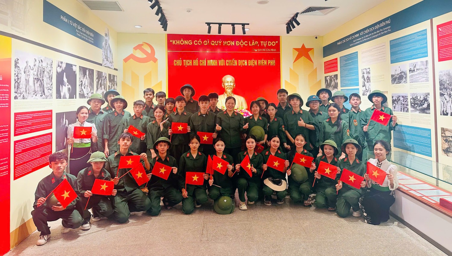 'A group of people in uniform holding flags

Description automatically generated'