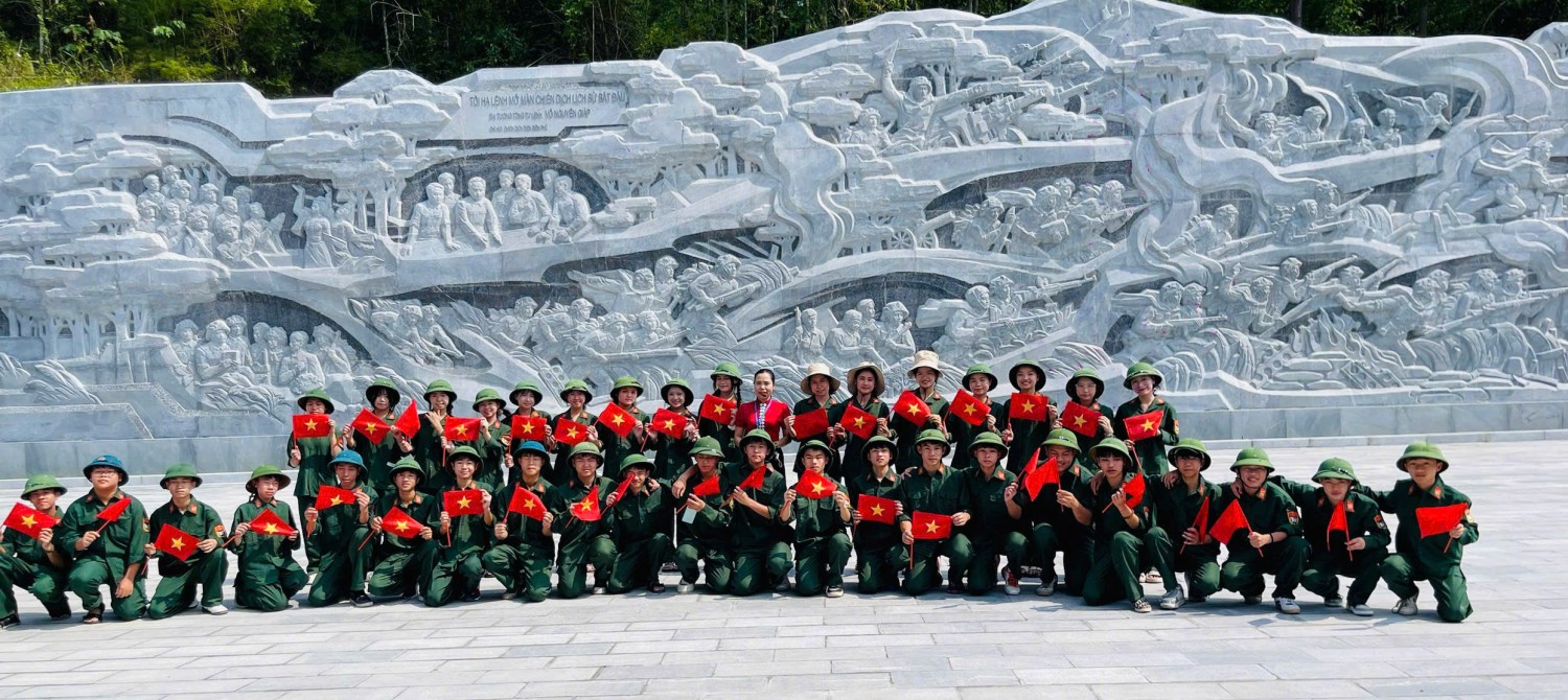 'A group of people in uniform posing for a photo

Description automatically generated'
