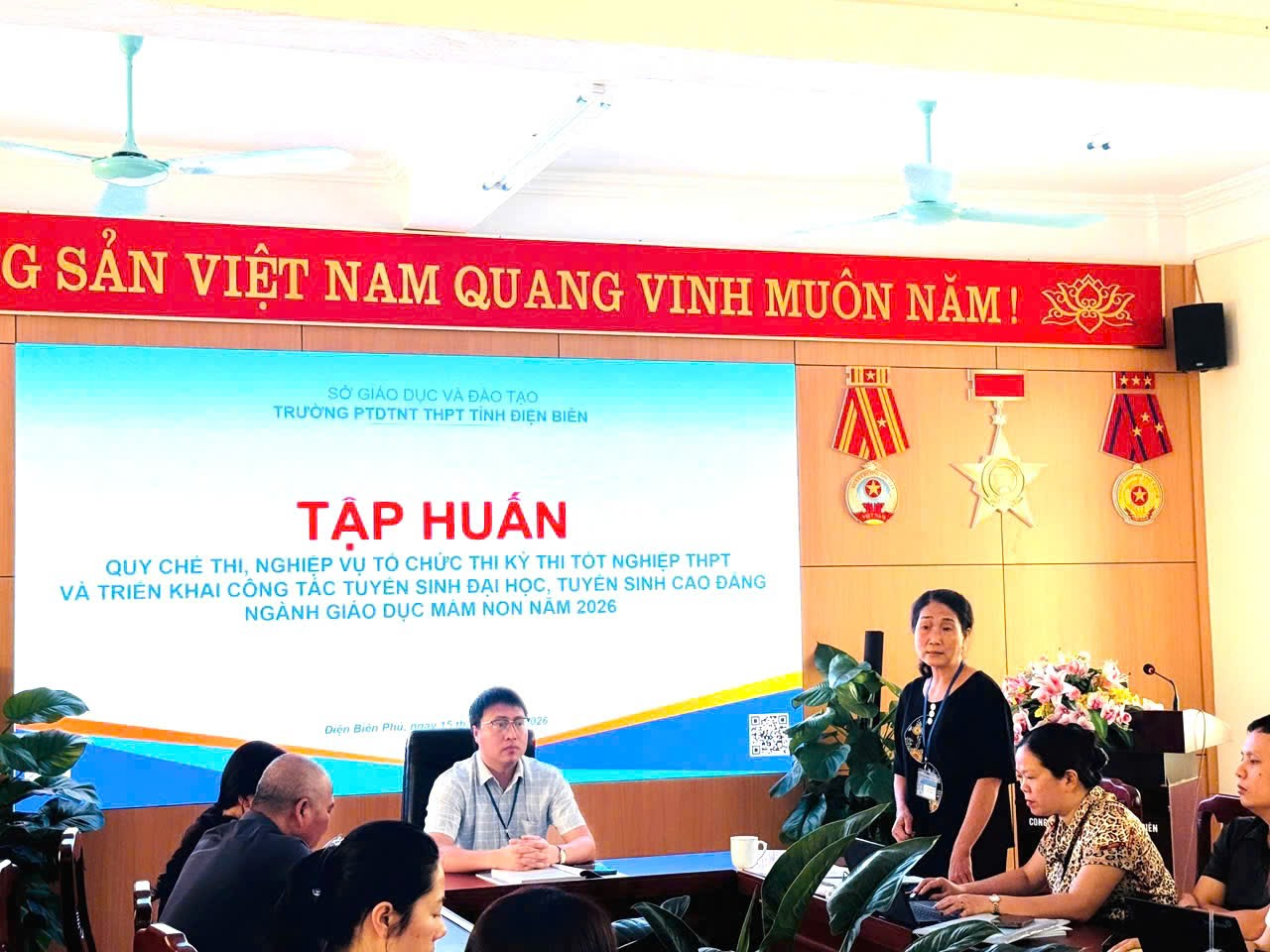 '''A group of people in a room

Description automatically generated'''